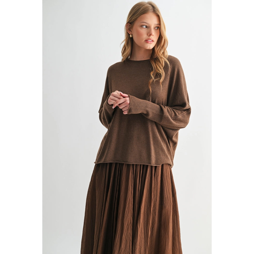 Woman wearing a brown outfit on a white background