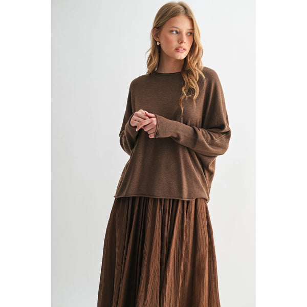 Woman wearing a brown outfit on a white background