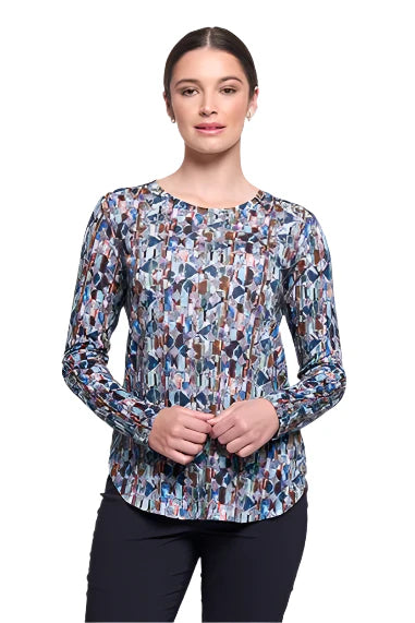 Woman wearing a patterned long-sleeve top on a white background