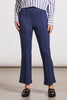 A person wearing a pair of navy blue bootcut trousers and a striped shirt, standing against a neutral background.