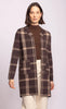 Woman wearing a brown and beige plaid coat on a white background