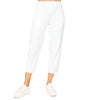 A pair of white French terry crop pants with elastic waistband, worn with white sneakers.